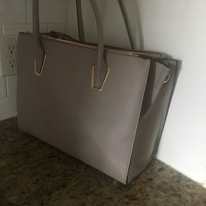 Large purse comes with shoulder strap